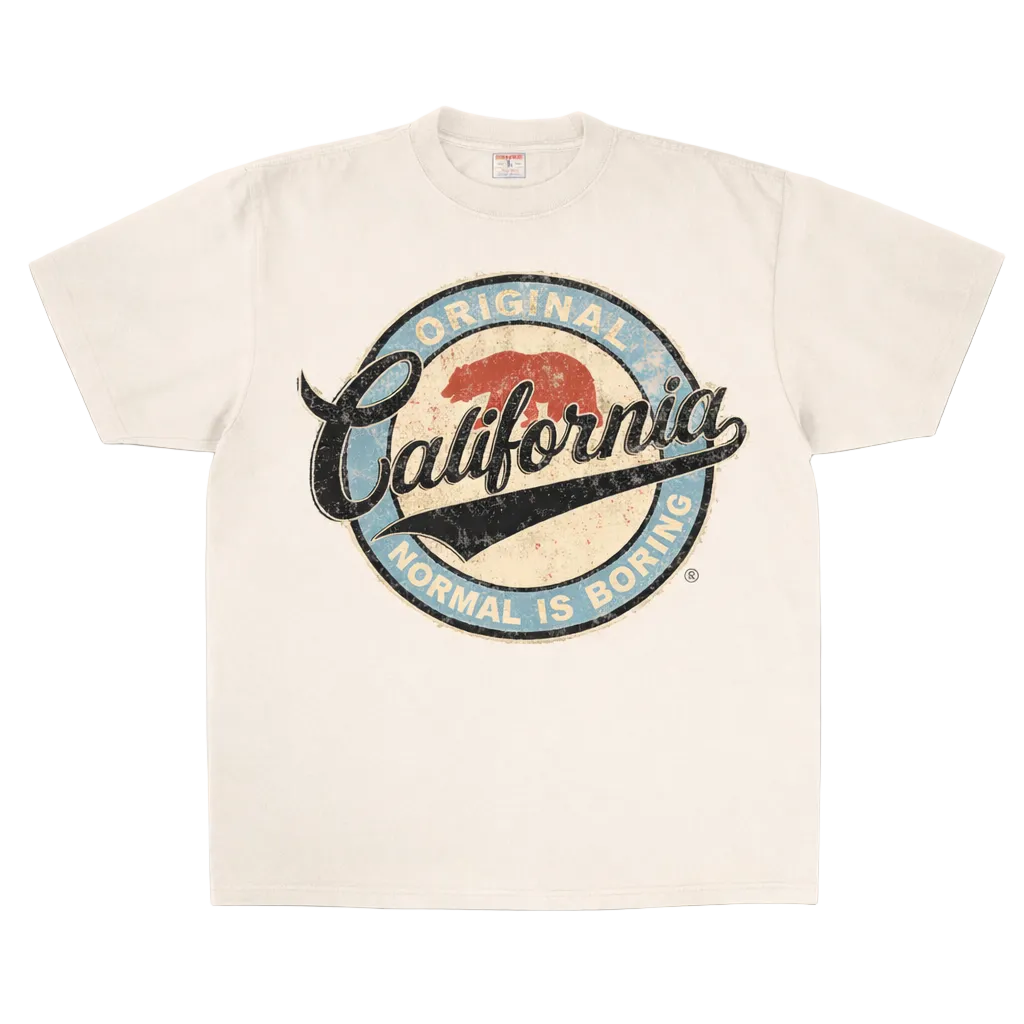 Beige t-shirt with 'Original California Normal is Boring' graphic design on a white background