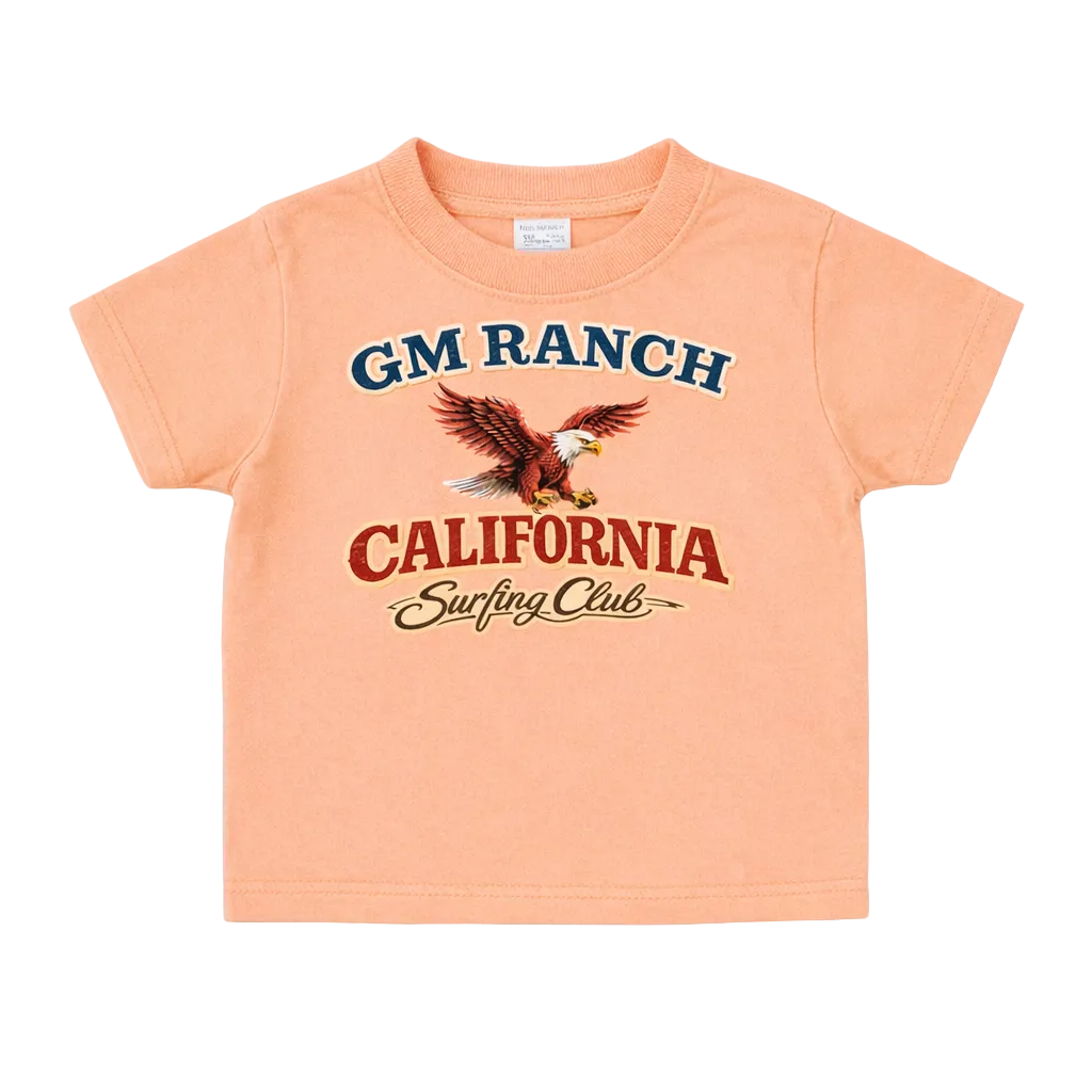 Peach-colored t-shirt with 'GM Ranch California Surfing Club' graphic on a white background