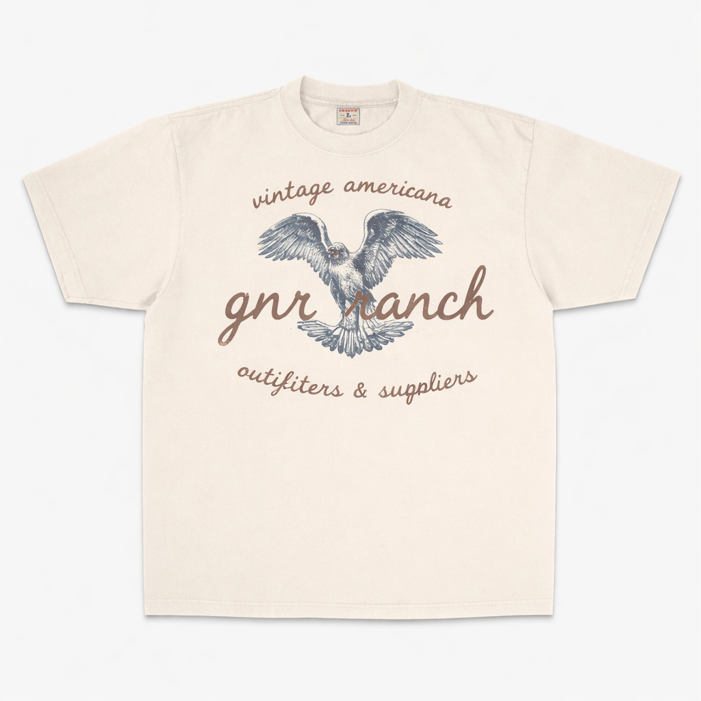 Beige t-shirt with eagle graphic and text on a white background
