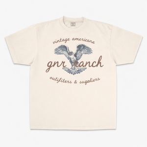 Beige t-shirt with eagle graphic and text on a white background